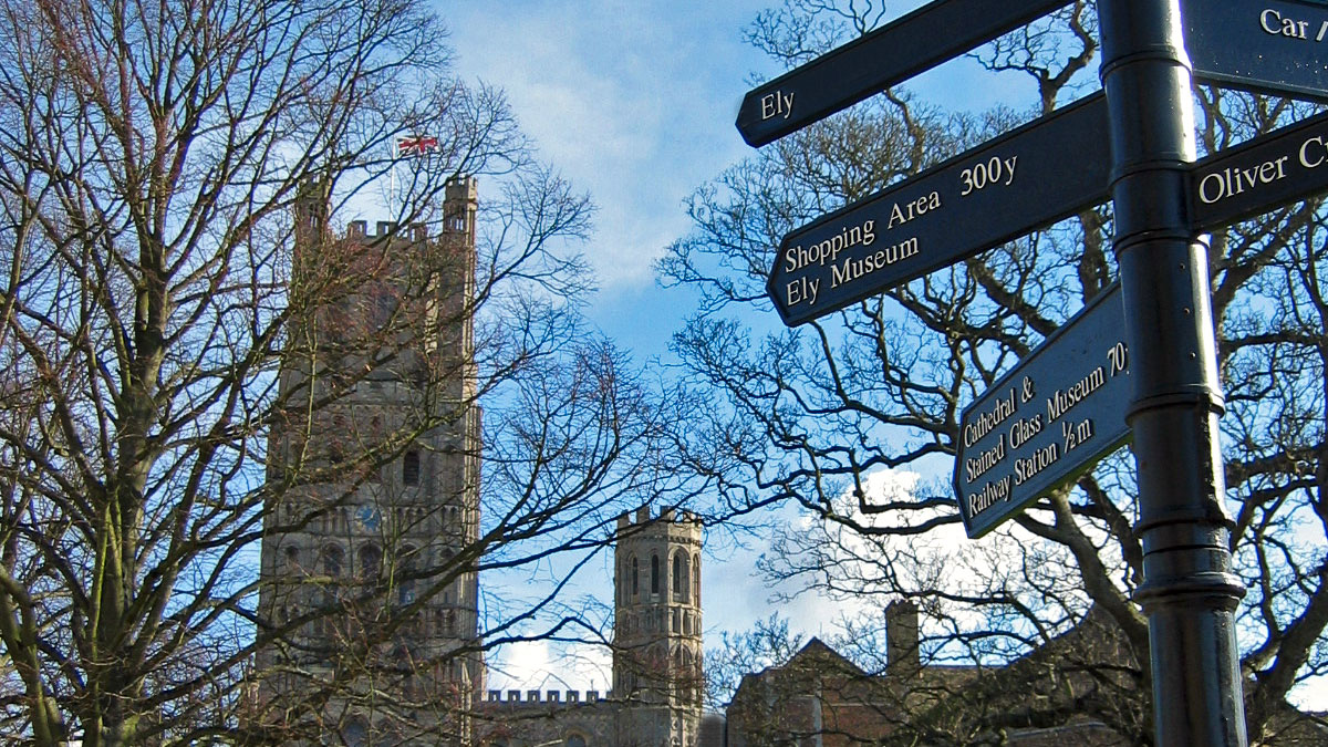 Ely historical building and street signpost 