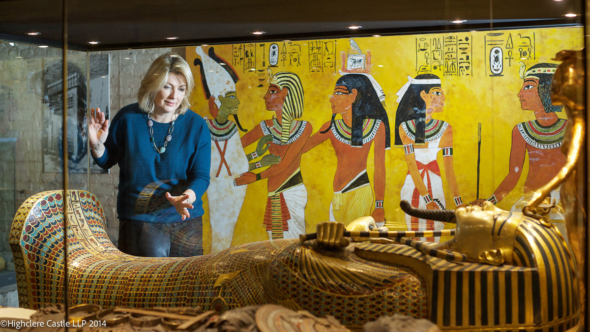 Woman looking at Egyptian Mummy coffin