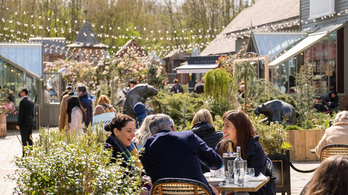 People sitting at Bicester shopping village